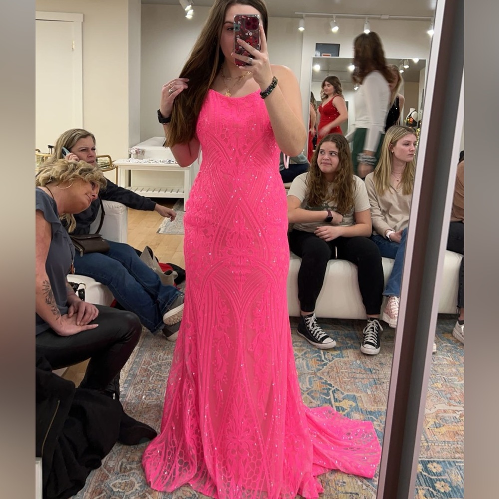 Brand is 2 Cute. It’s hot pink, in a size 6. It was worn once for a few hours.